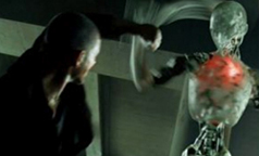 Robot fighting a man.