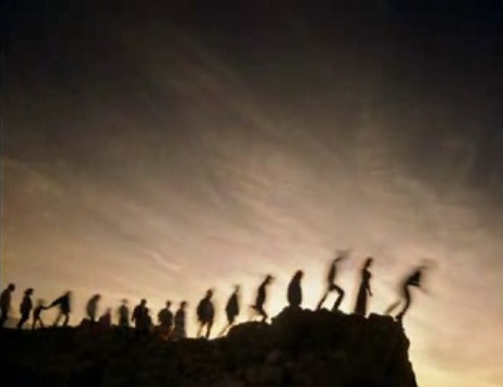 People walking off a cliff one by one.