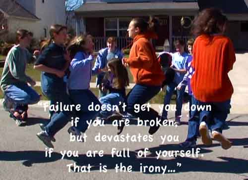 Girls up in the air as they are jumping rope