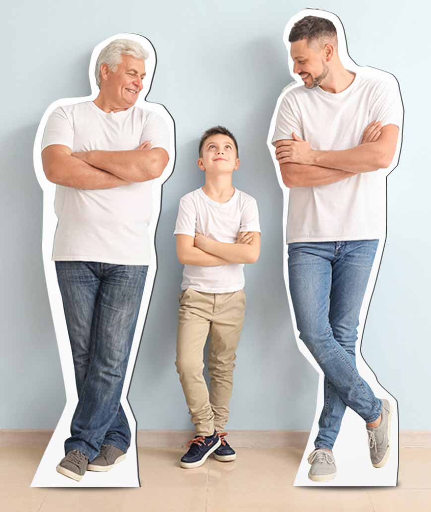Boy looking up at father and grandfather