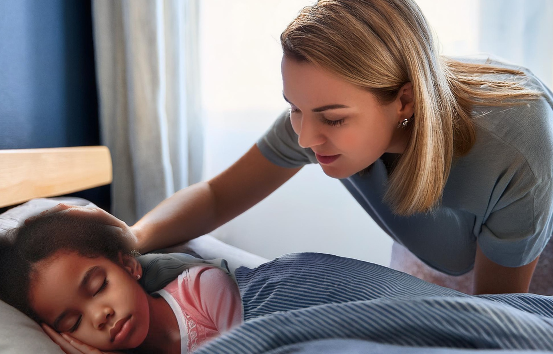 a mom gently waking up her daughter 