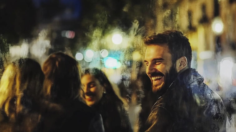 man laughing with freinds